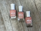 Three clear Sally Hansen Mega Strength nail polish bottles in rose gold, white cap, and navy bottles with pink labels.