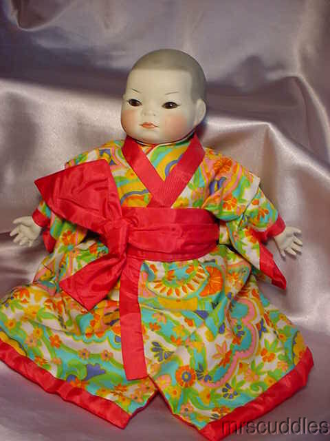 VINTAGE ORIENTAL STYLE CHINA HEAD & CLOTH BABY DOLL