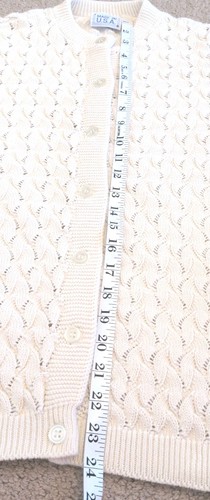 Cream knit women's long sleeve sweater with scalloped pattern, button front, and two vertical panels.