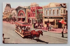 Postcard Main Street Horse Drawn Trolley Upjohn Pharmacy Disneyland California