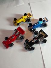 4 Unbranded F1 Race Cars. Lotus John Player March Ford Mclaren M23 Lotus 7879