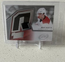 2015-16 SPx ROOKIE FABRIC #SPXR-NH NOAH HANIFIN RC CAROLINA HURRICANES