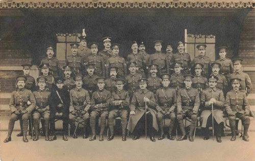 WW1 postcard Officer training course ? Mixed regimental cap badges