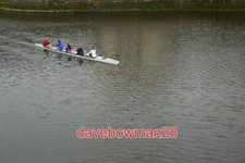 PHOTO  ROWING IN THE DOCKS THIS LADIES COXED FOUR WAS GETTING SOME EARLY SUMMER