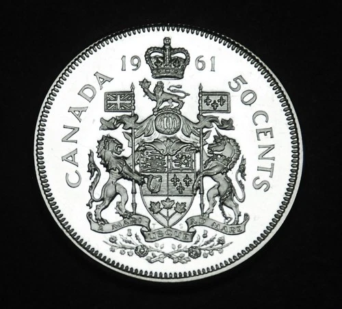 1961 50¢ silver coin that is UNC and MS in a paper flip Gorgeous and flawless