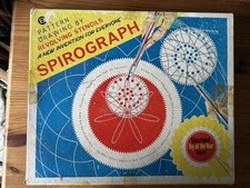 Vintage Spirograph drawing toy in box. One wheel missing.