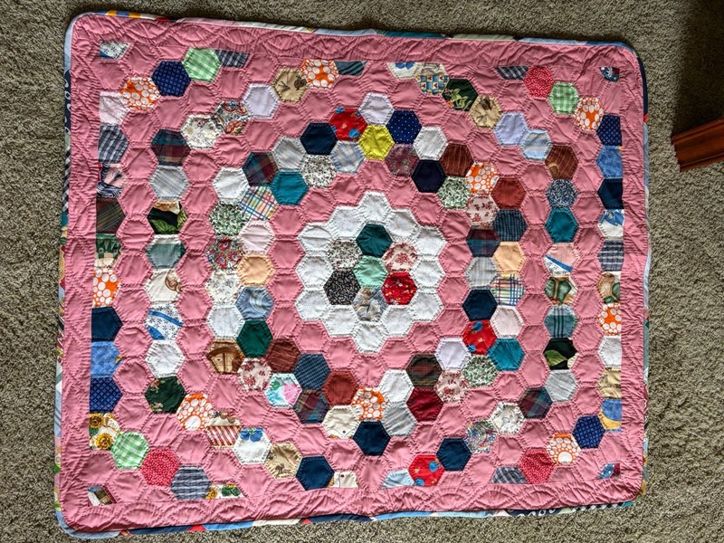 Handmade lightweight lap or baby quilt. Never used. Hand quilted. 33 x 41 inches