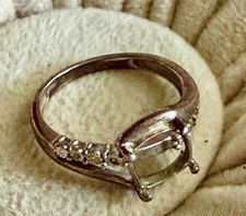 Vintage engagement setting with six diamonds, three on each side.