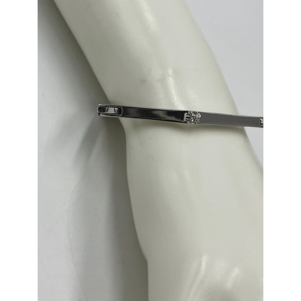 Pulsera angular con bisagras hexagonal elegante de acero inoxidable de diseño Tory Burch Foto 4 de 4