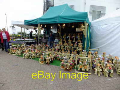 Photo 6x4 Wooden Bill and Bens Each with a plant for sale as a part of an c2013