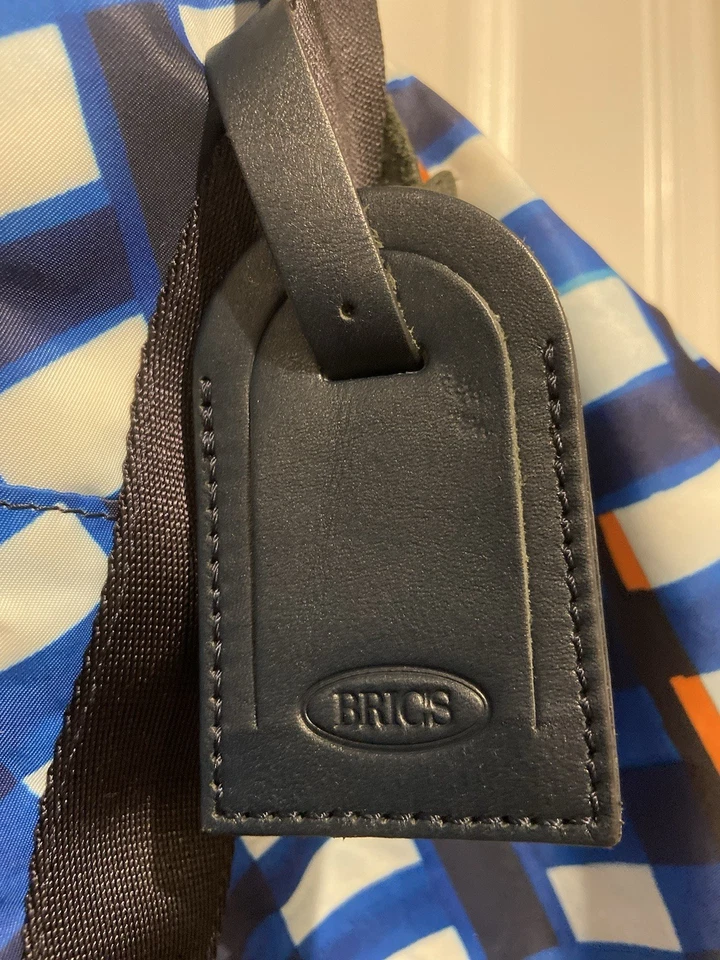 Bolsa de viagem dobrável Bric’s X-Travel laranja e azul, alças e etiquetas de couro - Imagem 4 de 4