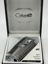 Vintage Colibri Quantum SST Ignition System in box, with cigar punch on bottom