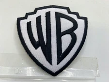 WARNER BROS  NEW EMBROIDERED IRON ON ON NAME PATCH  TAG  3 X 3