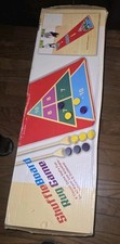 Shuffleboard Rug Game with Colored Pucks and Scoring Triangle
