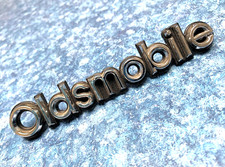 1981-1986 Oldsmobile Plastic Scriptemblem 22510798-3 5-14x78 Nos Unused