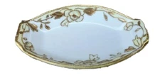 Open salt by Nippon with gold rim, floral, gold outlines, old spoke mark