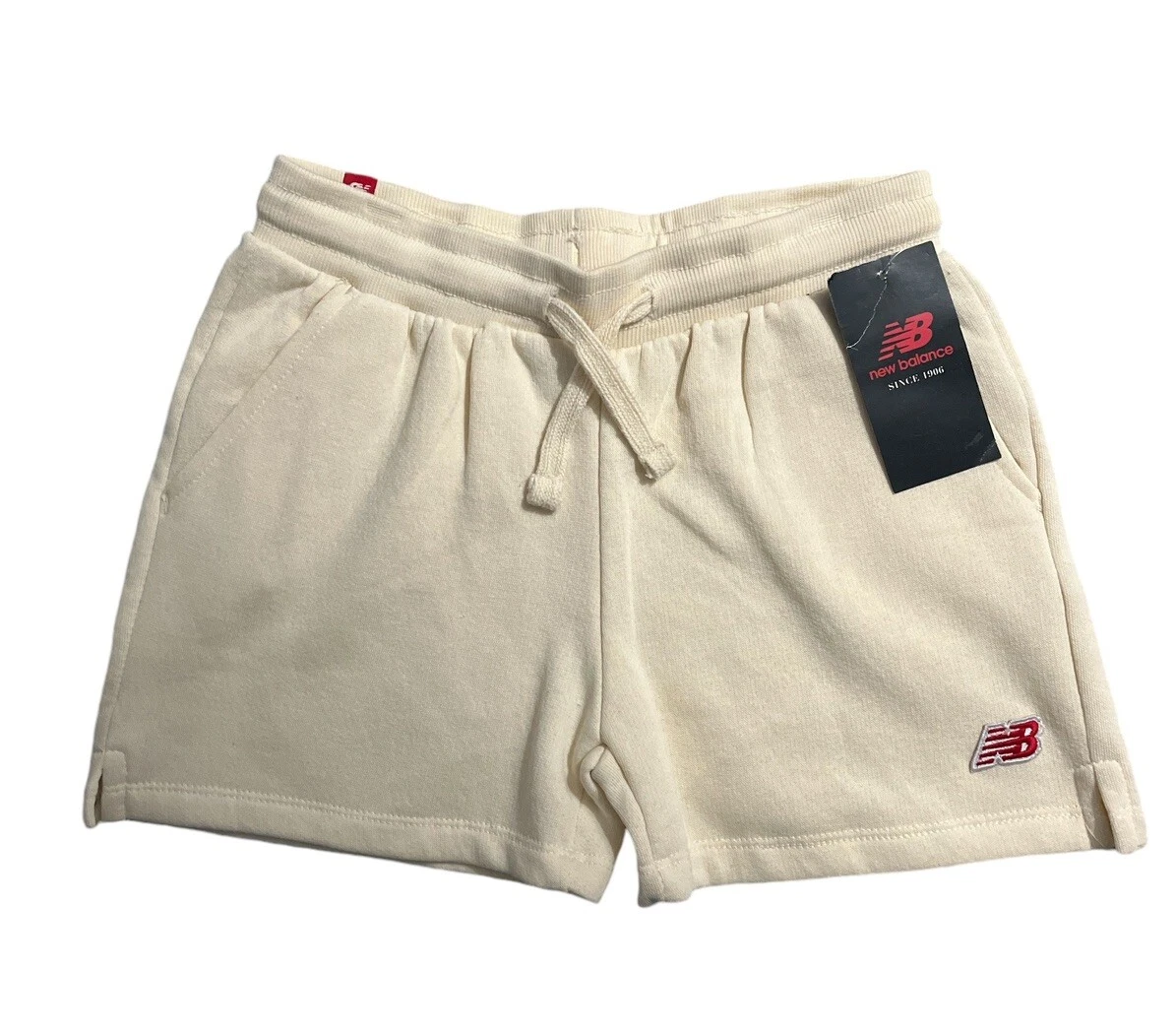 Pantaloncini New Balance da bambina con tasca nuovi con etichetta avorio taglia small (7)