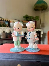 Vintage Kewpie doll pair in ceramic and hand numbered