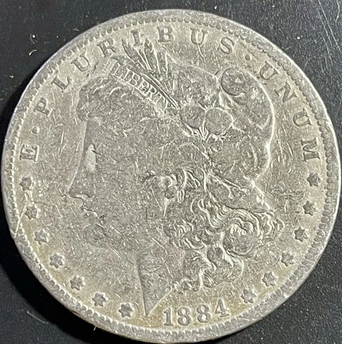 1884 $1 Morgan Silver Dollar. 90% Silver. #1670