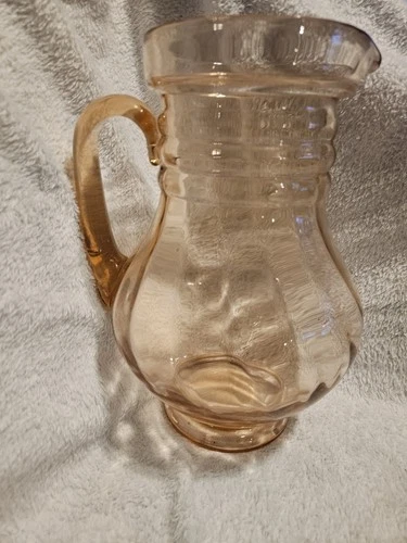 Vintage pink depression glass pitcher, likely from the 1930s Depression