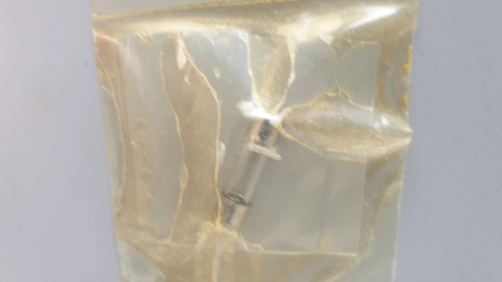 Small metal part in a sealed plastic bag supplied with the Daihen SMA-20B