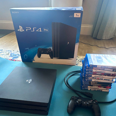 Sony PlayStation 4 Pro 1TB  in box with PS4 Games