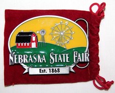VINTAGE 2010 NEBRASKA STATE FAIR BELT BUCKLE WITH CLOTH BAG, 461 0F 2500