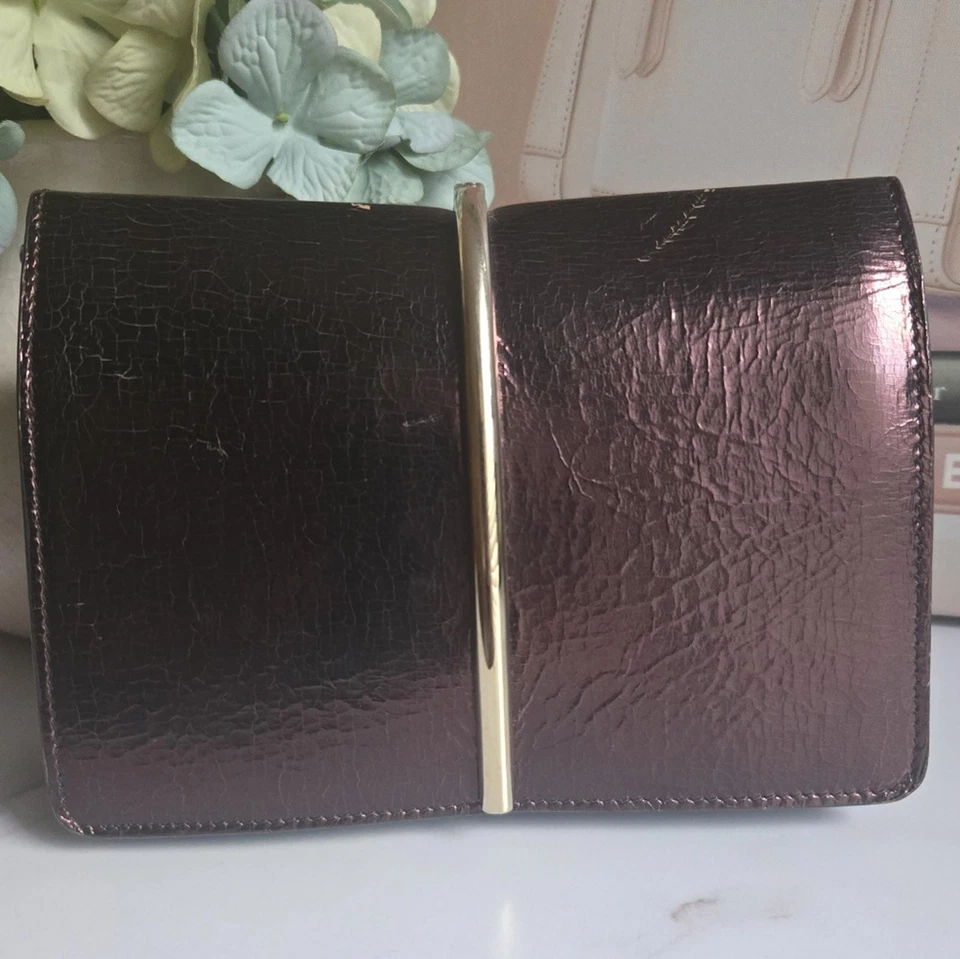 Bolso Clutch Bandolera Nina Ricci Arco Bronce Cuero Borgoña Usado en Excelente Condición Foto 3 de 4