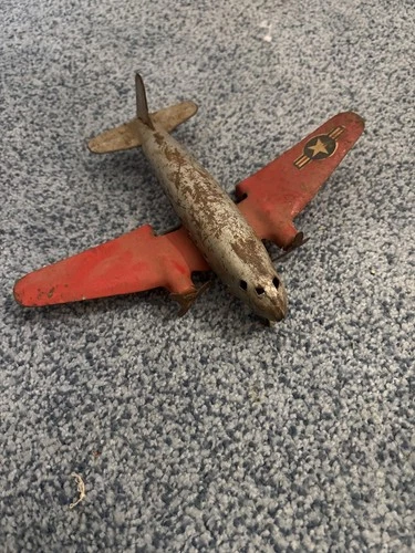 marx press steel red wing plane