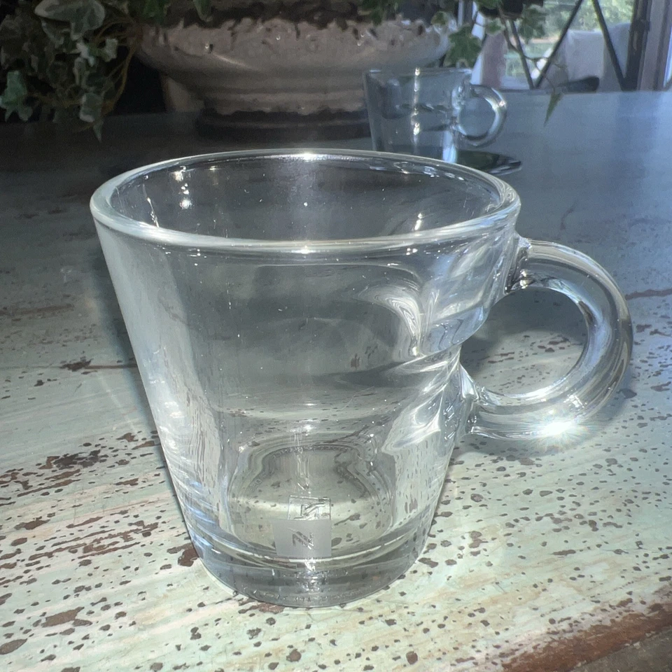 Juego de 2 tazas de café espresso de vidrio transparente Nespresso y platillos de acero inoxidable de 2" de alto Foto 3 de 4