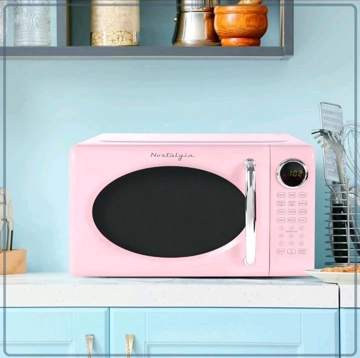 Nostalgia Retro Compact Countertop Microwave Oven - 0.7 Cu. Ft. - 700-Watts Pink
Opens in a new wind