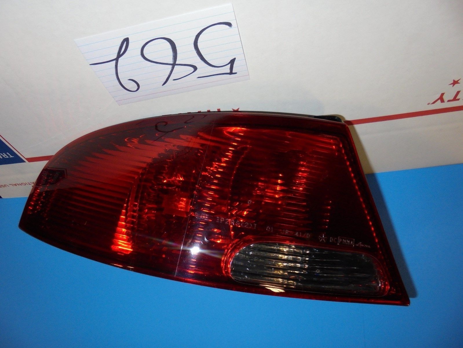 01 02 03 04 05 06 Dodge Stratus Rear DRIVER taillight Used tail light 582