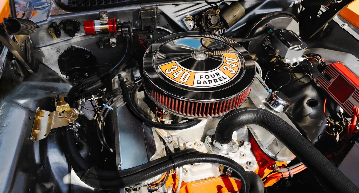 Four-barrel 340 cubic-inch V-8 engine
