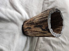 A handcrafted rustic wooden vase that is collectible.