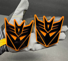2x Decepticon Transformer Mask Car Fender Badge Emblem Black On Orange Decal