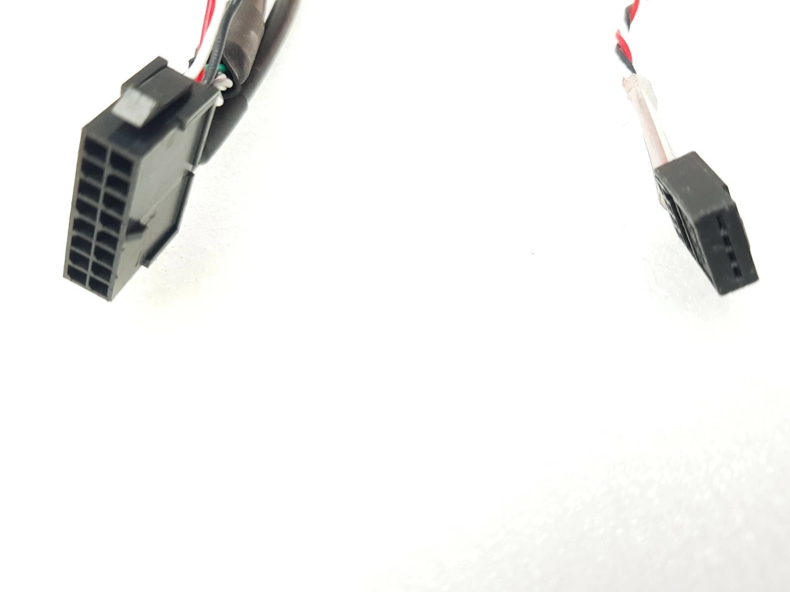 Black multi-pin connectors on the Emerson XVM-8017 motor leads