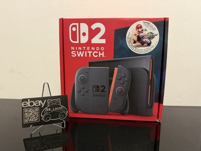 Nintendo Switch Console Mario Kart World Game Bundle In Hand