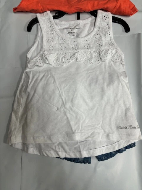 JUEGO DE 3 BLUSAS CALVIN KLEIN NIÑAS SHORTS/2 (NARANJA/BLANCO/AZUL 4T) NUEVO CON ETIQUETAS Foto 2 de 4