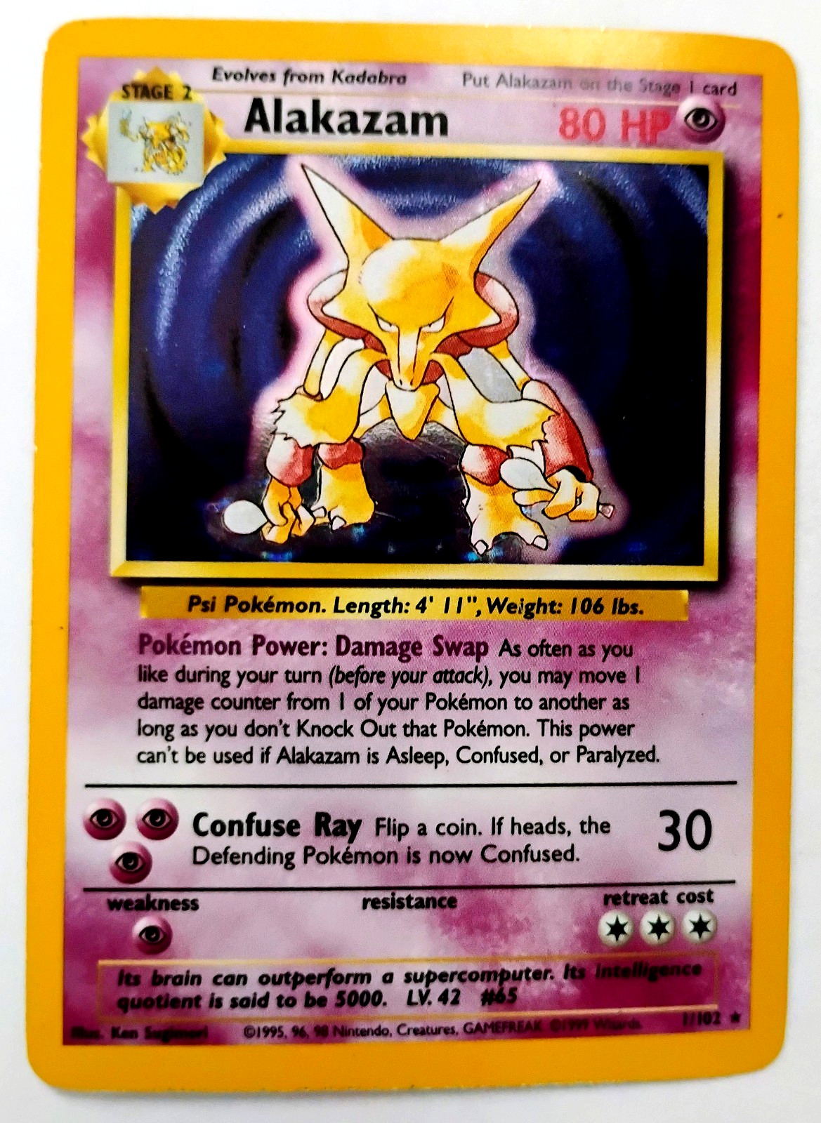 1999 POKEMON HOLOFOIL ALAKAZAM 1/102 #65BASE SET WOTC TCG  HOLOGRAM CARD NM/MINT