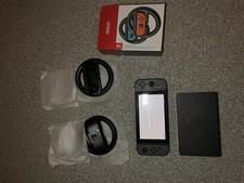 Nintendo Switch Handheld Gaming Accessory with Dock and Controllers