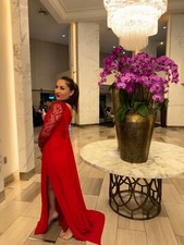One shoulder dress. Evening gown, with thigh high split and fully beaded sleeve.