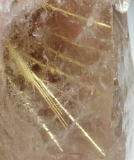 Terminated Quartz crystal with golden Rutile inclusions. Brazil. 35 grams.
