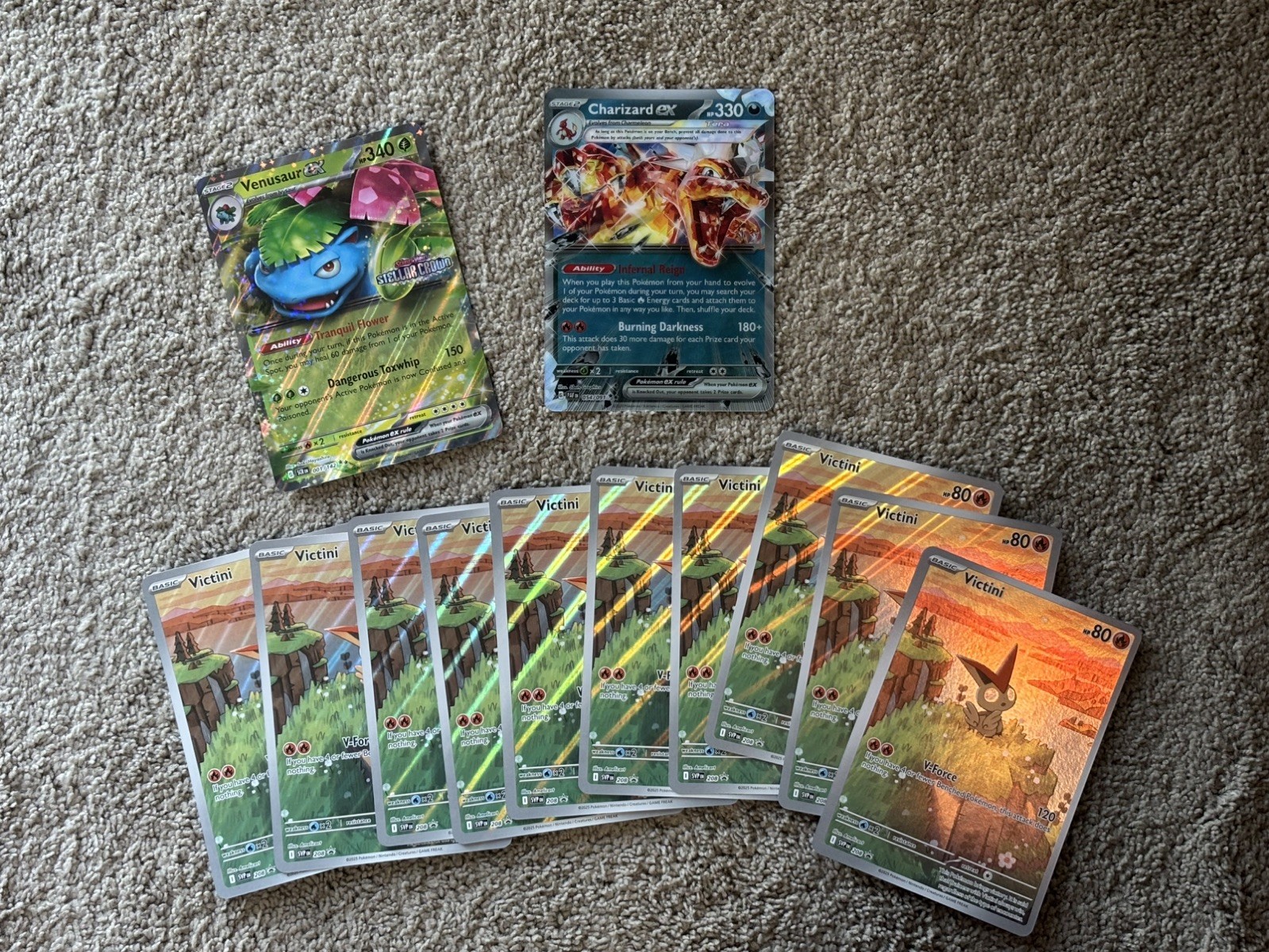 Lot of 12. 10 Victini JUMBO Card plus 1 Charizard & 1 Venusaur Jumbo Cards.