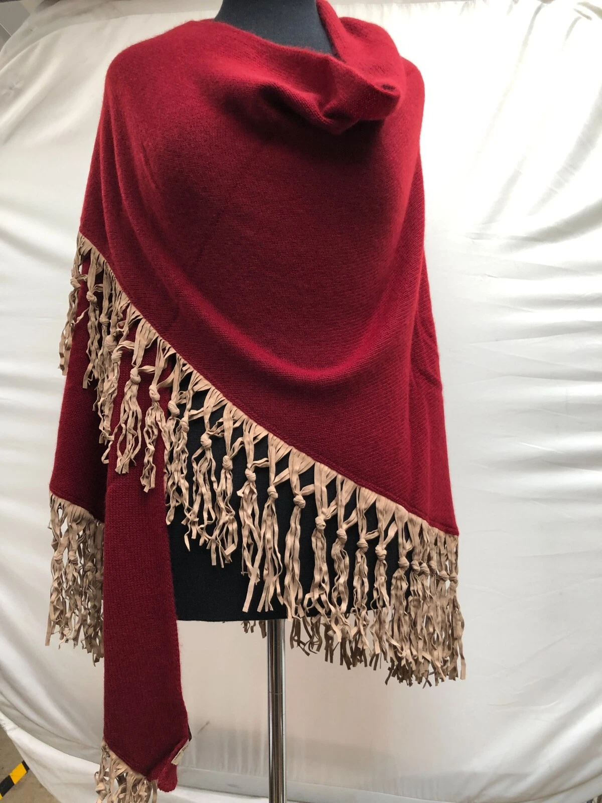 100% Cashmere poncho with suede Fringing.