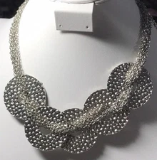 Multi strand necklace with 5 metal embossed disks