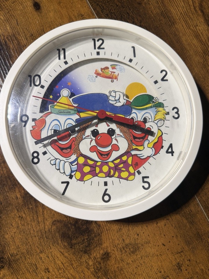 A working vintage Sunbeam clown wall clock — equal parts creepy and charming, a guaranteed conversation starter in any room brave enough to hang it.