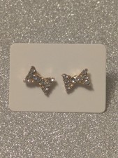 Gold-coloured diamond bow studs