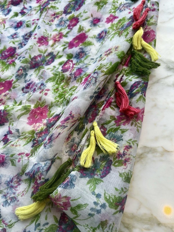 Do Everything In Love brand infinity Scarf in floral pattern with tasseled trim