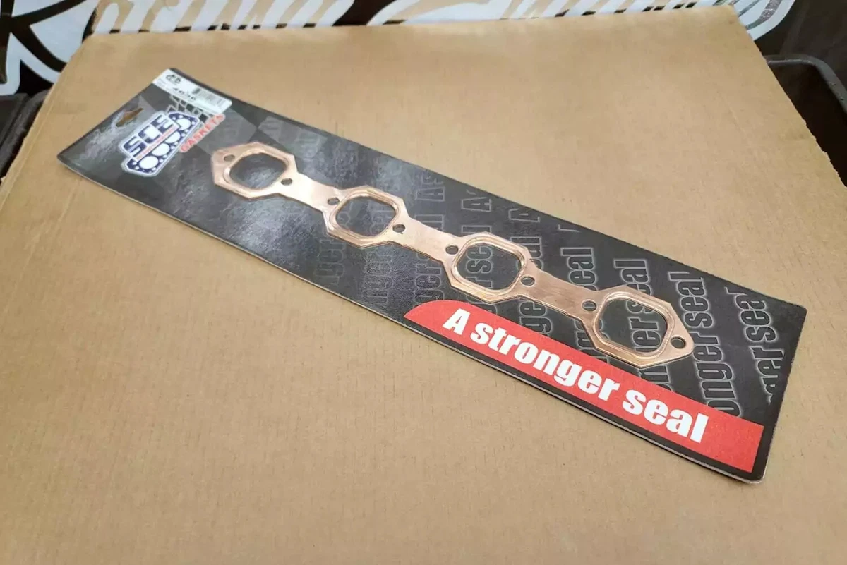 A set of Mr. Gasket copper seal header gaskets displayed on a white background. 