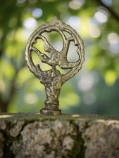 Brass lamp finial with Flying Swallows. 